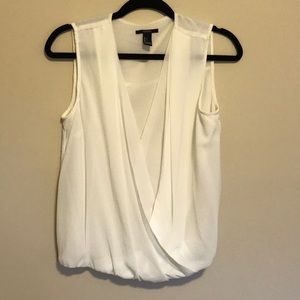 White sleeveless blouse